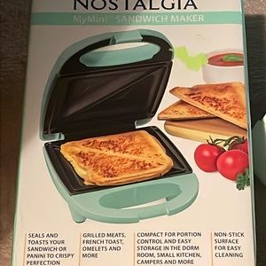 Light blue sandwich maker. Used once. Good condition